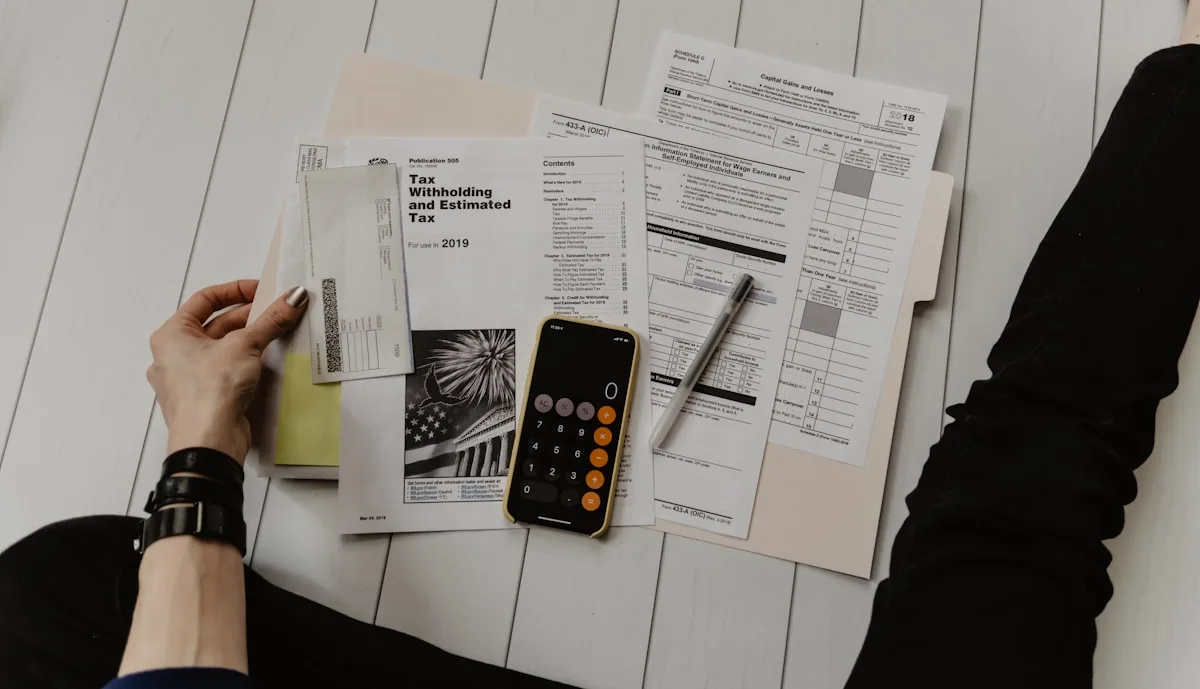 Price to manage website per month — budget planning and financial review at a desk