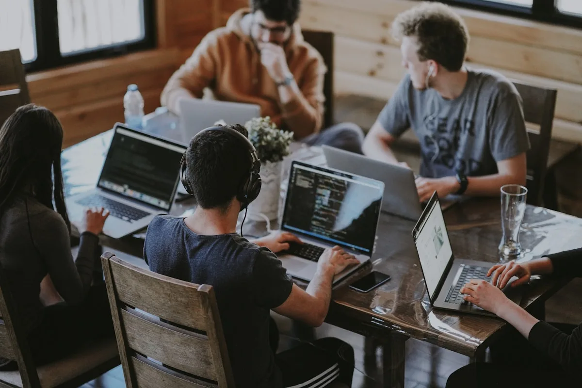 WordPress managed unlimited website pricing — agency team managing multiple client websites on screens